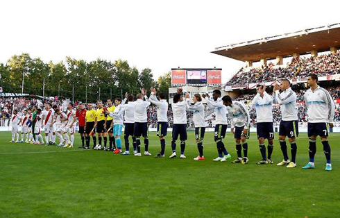 Real Madrid and Rayo Vallecano teams lined up in the Vallecas stadium