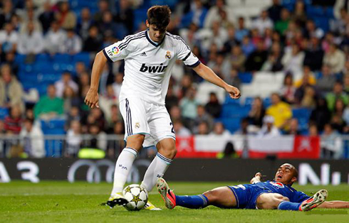 Alvaro Morata sitting down a defender, before scoring a goal for Real Madrid, in 2012-2013