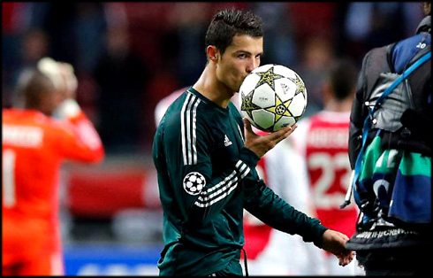 Cristiano Ronaldo kissing the UEFA Champions League ball game, after completing an hat-trick in Ajax vs Real Madrid, in 2012-2013