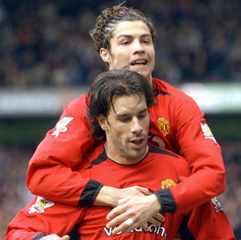 Cristiano Ronaldo on Ruud van Nistelrooy's back, celebrating a Manchester United goal in 2003
