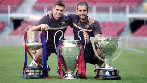 Pep Guardiola and Tito Vilanova posing for a photo with Barcelona trophies
