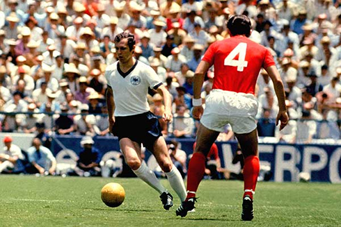 Franz Beckenbauer driving the ball in a match for Deutschland Germany National Team