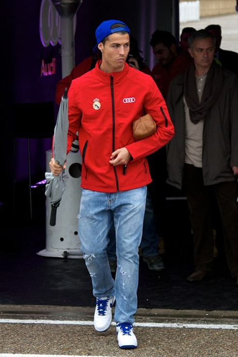Cristiano Ronaldo with a red Audi jacket, walking towards his new Audi R8 car, given to all Real Madrid players in 2012-2013