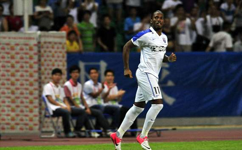 Didier Drogba playing in a white Shanghai Shenhua jersey, in 2012-2013
