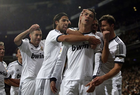 Cristiano Ronaldo celebrating goal near the Santiago Bernabéu stands, with Benzema, Sami Khedira, Pepe and Xabi Alonso, in 2012-2013