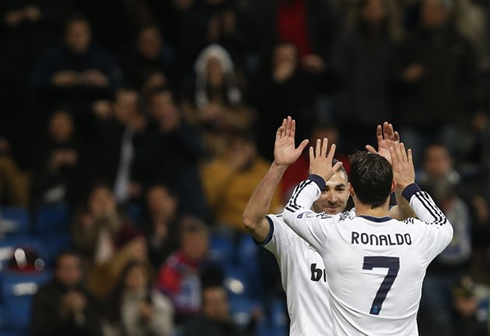 Cristiano Ronaldo touching hands with Karim Benzema, in Real Madrid 2012-2013