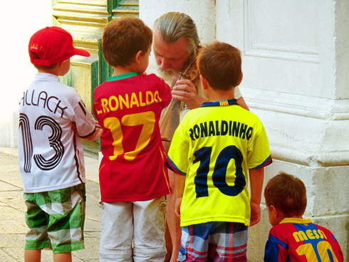 Kids wearing Lionel Messi, Ronaldinho and Cristiano Ronaldo jerseys, kits and shirts