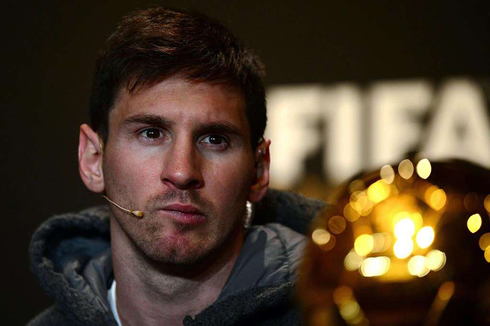 Lionel Messi focused on a question being made at the FIFA Balon d'Or 2012 event