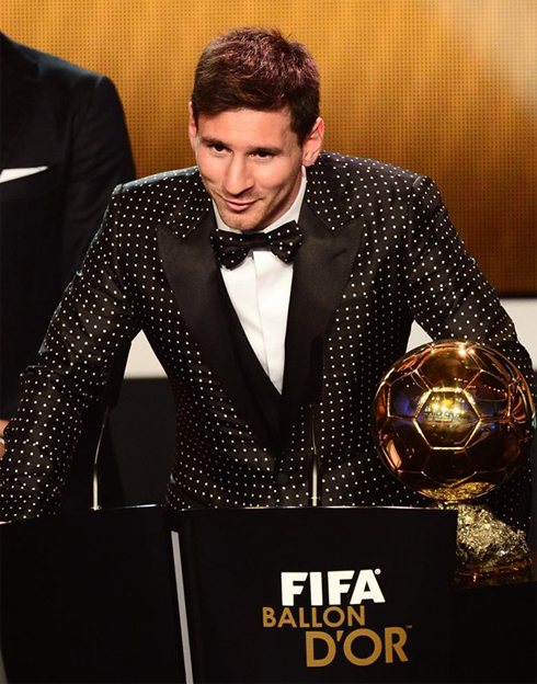 Lionel Messi leaning forward on stage, at the FIFA Balon d'Or 2012 ceremony