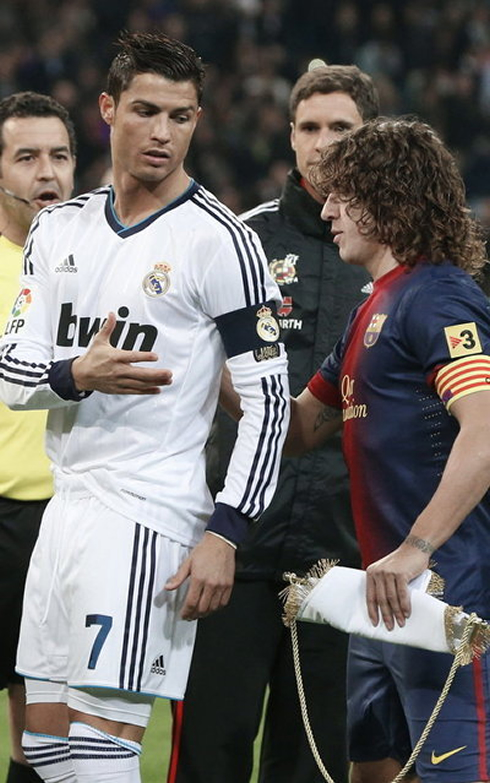 Cristiano Ronaldo and Carles Puyol, Real Madrid and Barcelona captains, exchanging gifts and souvenirs before the Clasico in 2013