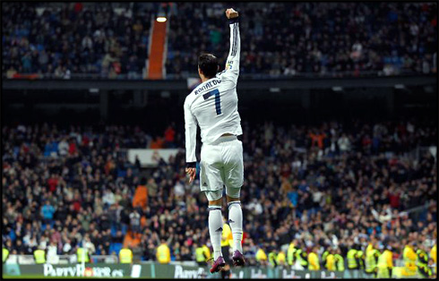 Cristiano Ronaldo jumping high in Real Madrid's goal celebration, in 2013