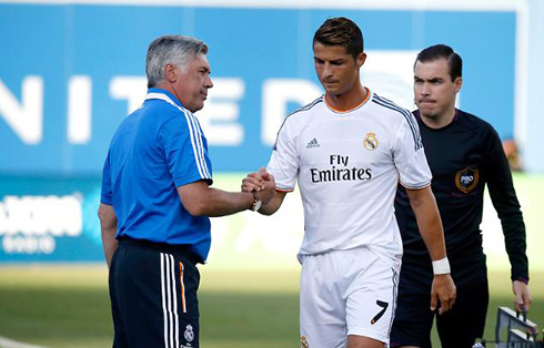 Cristiano Ronaldo giving an hand shake to Carlo Ancelotti, in Real Madrid 2013