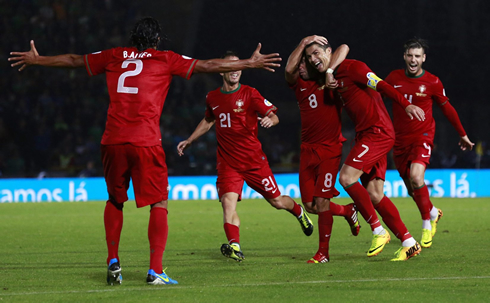 Cristiano Ronaldo celebrating a goal with his Portuguese teammates