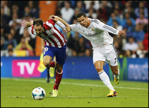 Cristiano Ronaldo and Juanfran fighting for a ball in Real Madrid vs Atletico Madrid