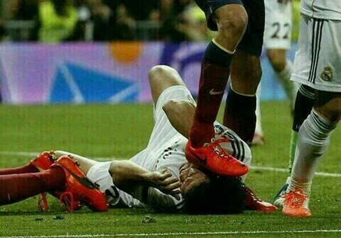 Busquets stomping Pepe on his head, during a fight at the Clasico Real Madrid vs Barcelona