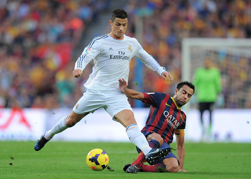 Cristiano Ronaldo tackled by Xavi in Real Madrid vs Barcelona