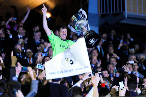 Iker Casillas lifting the Copa del Rey trophy, in the stands tribune