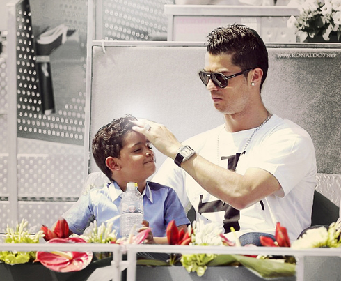 Cristiano Ronaldo combing his son's hair