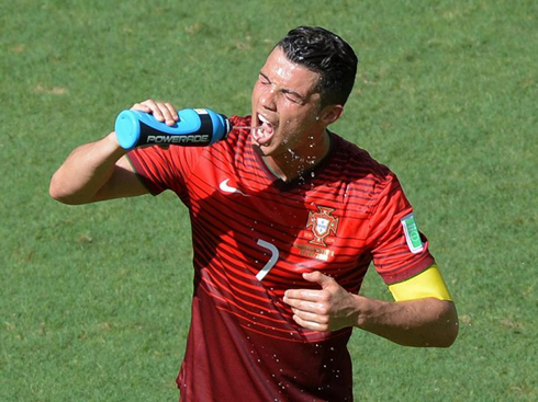 Cristiano Ronaldo thirsty and drinking water in the FIFA World Cup 2014