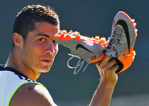 Cristiano Ronaldo waving with his boots