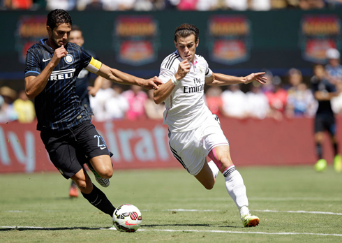 Gareth Bale running past a defender in Inter Milan vs Real Madrid, at the pre-season 2014-15