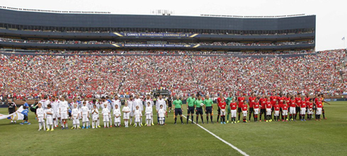 Real Madrid and Manchester United teams lined up before the kickoff of a friendly at the Michigan stadium