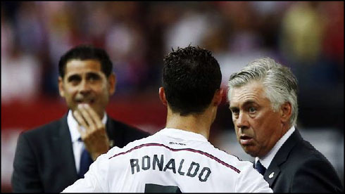 Ancelotti instructing Cristiano Ronaldo, with Hierro standing by