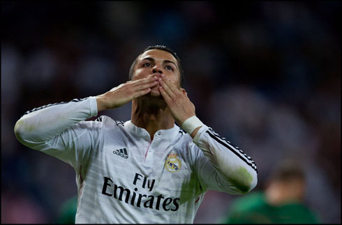 Cristiano Ronaldo blowing out kisses to the fans, after scoring a poker of goals for Real Madrid