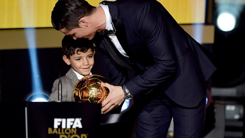Cristiano Ronaldo kissing his son at the 2014 FIFA Ballon d'Or awards ceremony