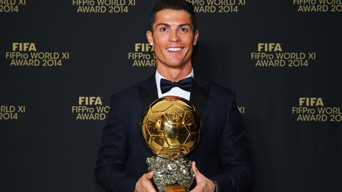 Cristiano Ronaldo posing with the 2014 FIFA Ballon d'Or trophy