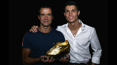 Jorge Mendes holding the Golden Shoe award next to Cristiano Ronaldo
