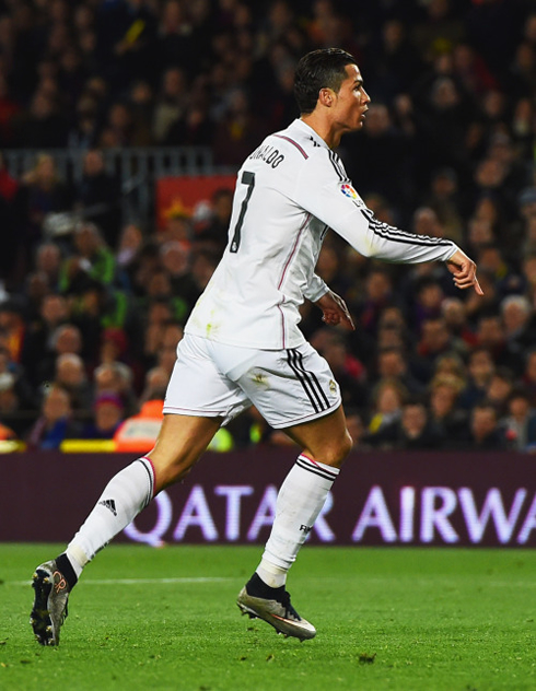 Cristiano Ronaldo tells the Barcelona fans to calm down after scoring for Real Madrid
