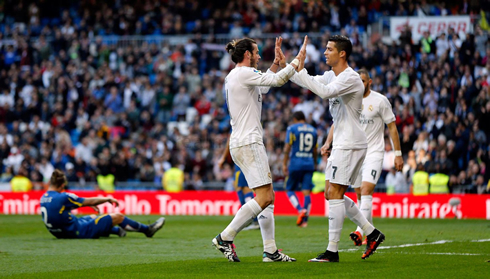 Bale and Ronaldo clap hands on each other
