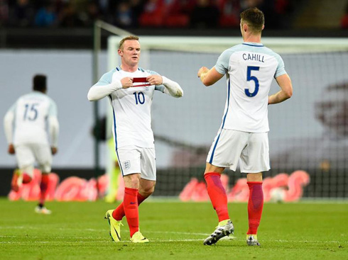 Wayne Rooney taking off the captain armband in England
