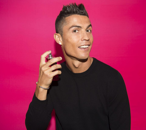 Cristiano Ronaldo putting on his CR7 fragance