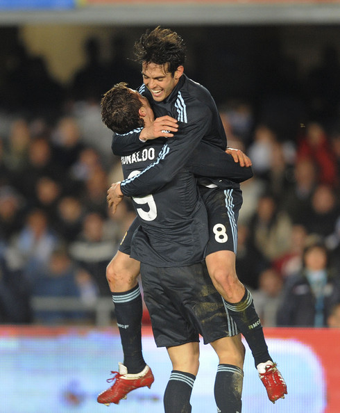 Cristiano Ronaldo holding Kaká on his lap