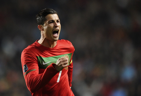 Cristiano Ronaldo running and celebrating a goal for Portugal