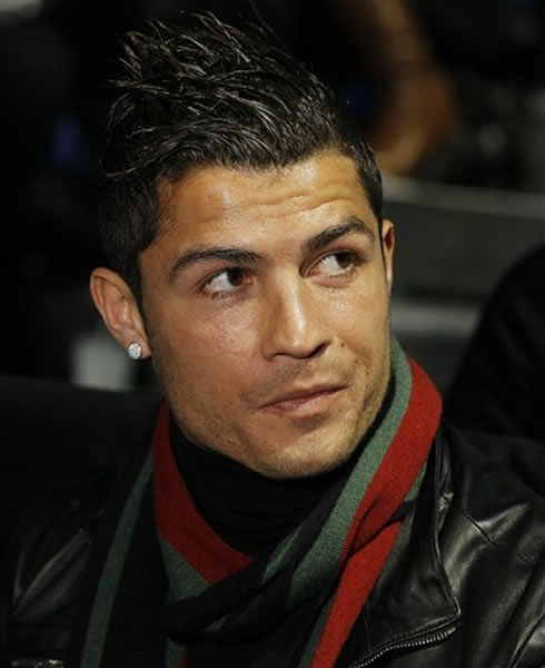 Cristiano Ronaldo with a new haircut and wearing a red and and green scarf (Portuguese colours)