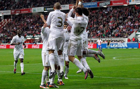 Cristiano Ronaldo and Real Madrid players jumping, in the goal celebrations against Sporting Gijón