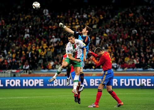 Cristiano Ronaldo jumping with Iker Casillas and Gerard Piqué, in Portugal vs Spain