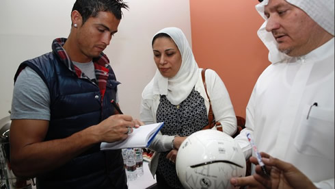 Cristiano Ronaldo in Dubai, signing autographs on soccer balls to some fans
