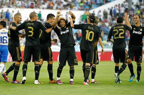 Cristiano Ronaldo and Real Madrid players celebrating a goal