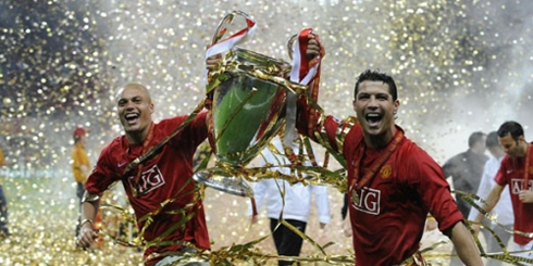 Cristiano Ronaldo celebrating and lifting the UEFA Champions League trophy, in Manchester United