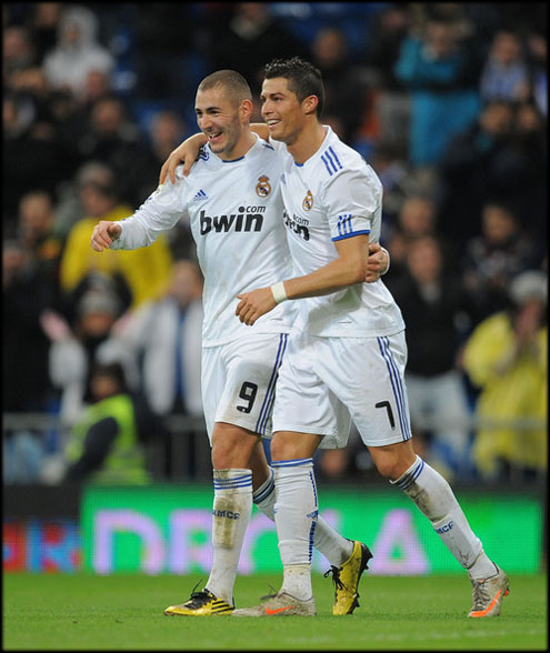 Cristiano Ronaldo and Benzema happy after scoring a goal