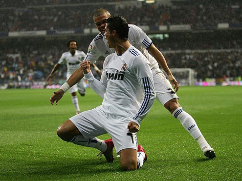 Cristiano Ronaldo celebrating a goal with Pepe close to him