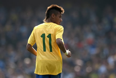 Neymar running and looking behind in a #11 Brazil jersey