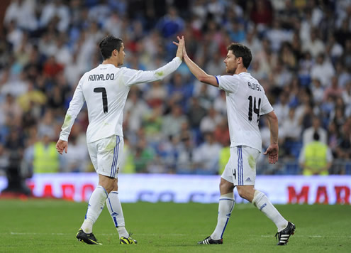 Cristiano Ronaldo touches hands with Xabi Alonso in Real Madrid 2010-2011