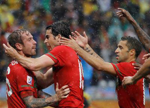 Raúl Meireles, Tiago and Simão Sabrosa showing their joy after scoring a goal for Portugal
