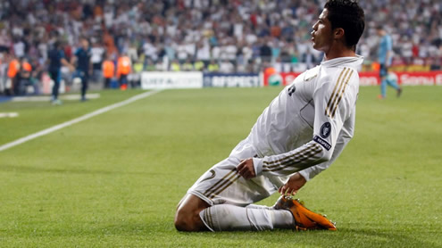 Cristiano Ronaldo going for his knee sliding celebration in a Real Madrid match for the UEFA Champions League, in 2011-2012
