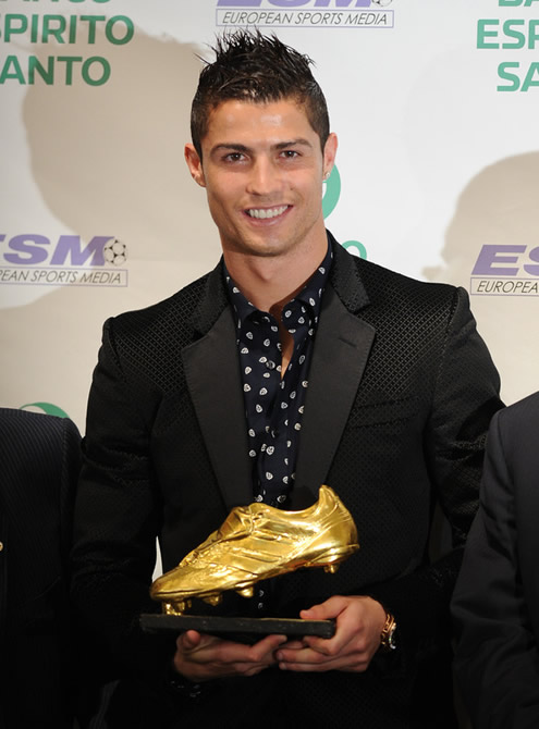 Cristiano Ronaldo smiling with the European Golden Shoe trophy 2010/2011